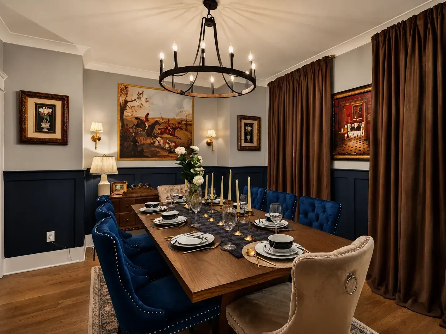 Formal dining room under a wrought-iron chandelier