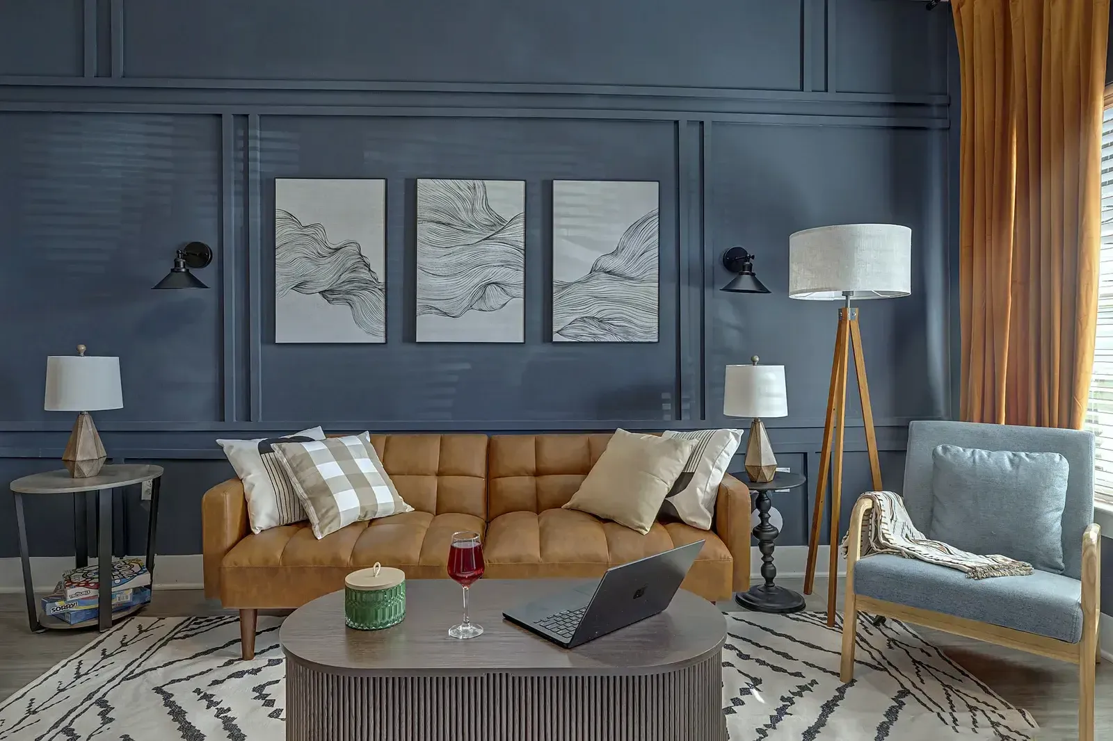 Living room with leather sofa and paneled accent wall