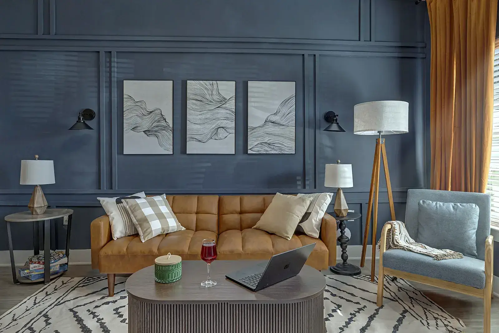 Living room with leather sofa and paneled accent wall