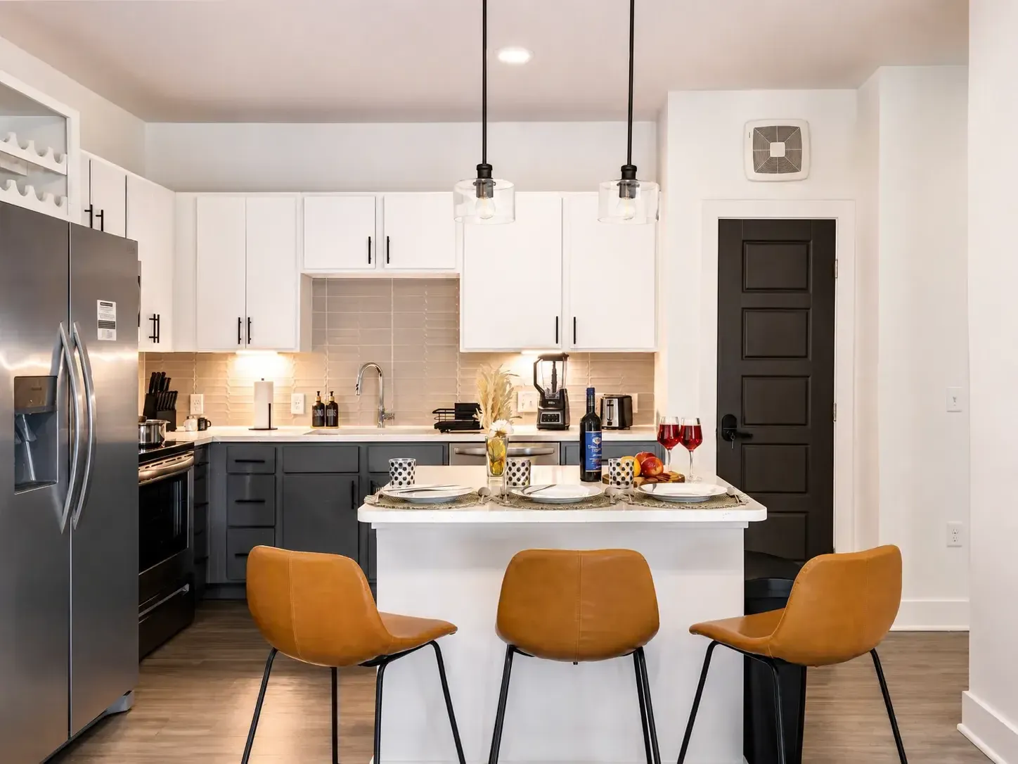 Modern kitchen with island seating and stainless appliances
