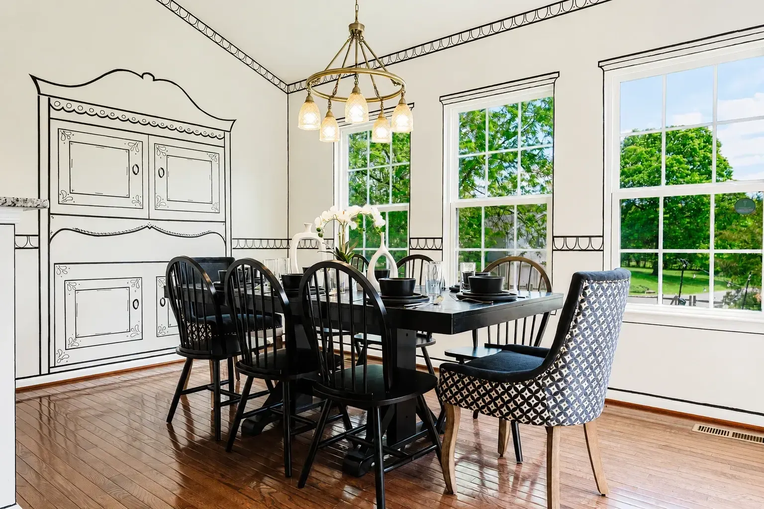 Dining room with seating for eight and garden views