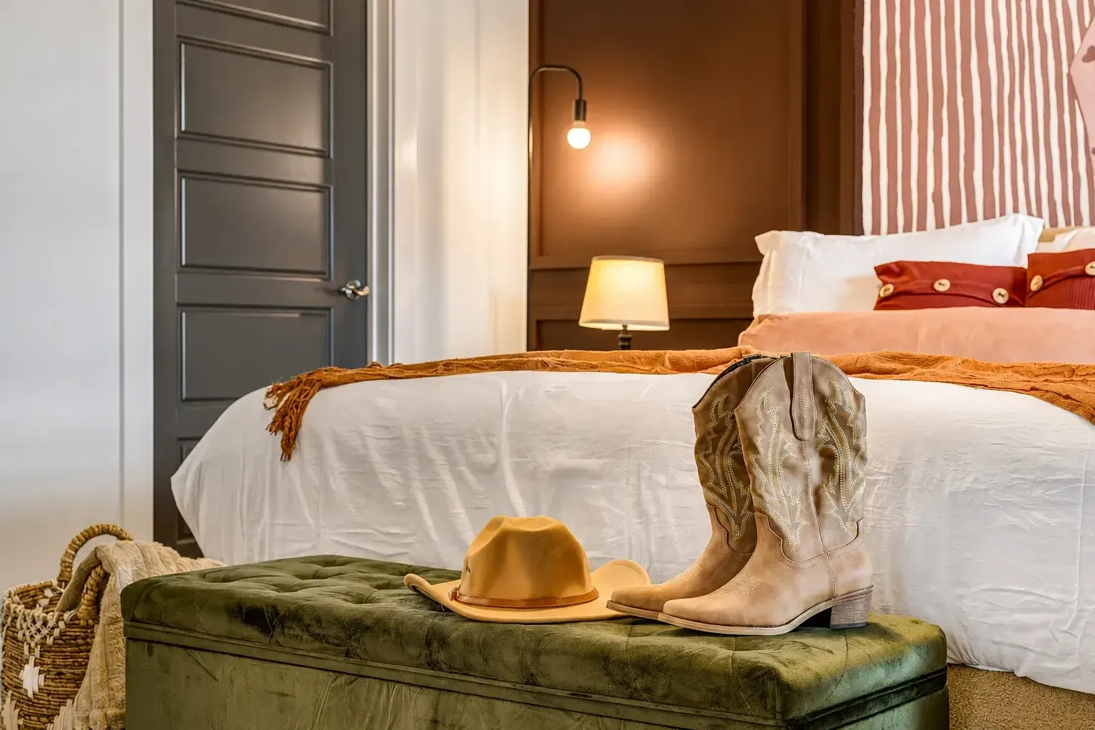 Bedroom with reading lamp and accent pillows
